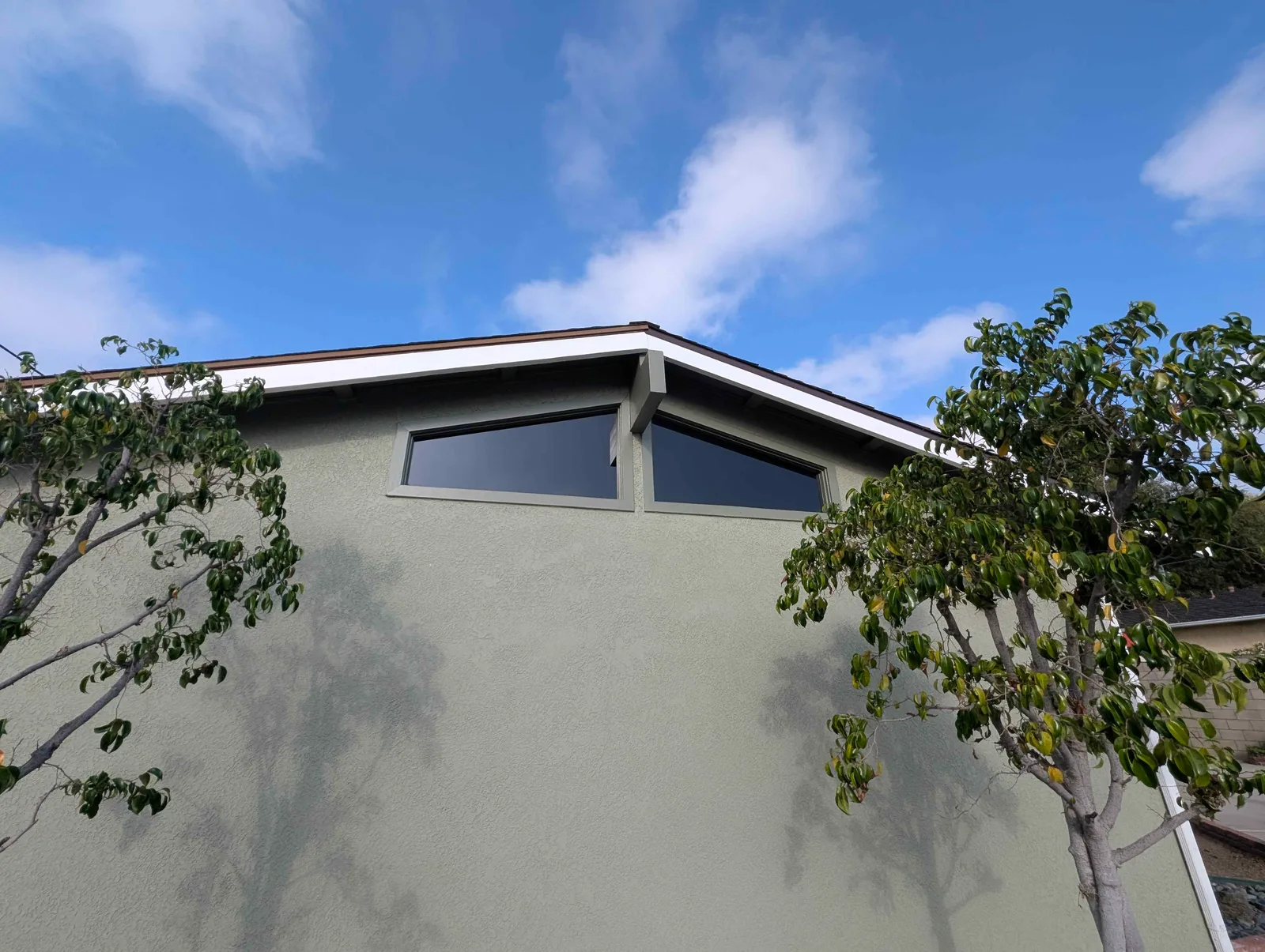 High clerestory windows under the roof gable after cleaning